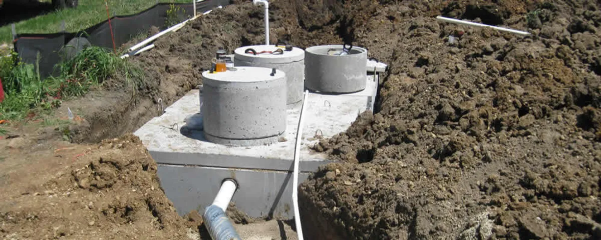 Septic system repair and installation site with tank access ports in Flagstaff, AZ