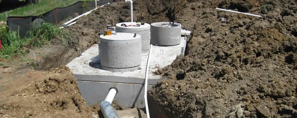 Septic system repair and installation site with tank access ports in Flagstaff, AZ